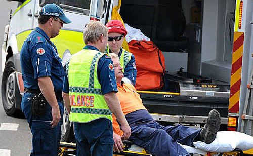 Emergency services assist the truck driver. Emergency services assist the truck driver.